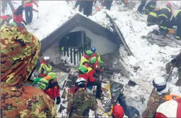  ?? CNSAS/AFP ?? Rescue teams work at the avalanche-hit Hotel Rigopiano, near the village of Farindola, on the eastern lower slopes of the Gran Sasso mountain.
