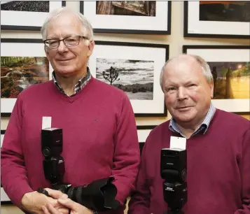  ??  ?? John Hickey and John McGowan at the Greystones Camera Club Exhbition at Hillside Church, Greystones.