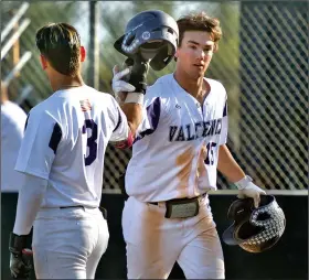  ?? Dan Watson/The Signal (See additional photos on signalscv.com) ?? (Above) Valencia’s Brock Kleszcz (15) celebrates with teammate Jacob Marquez (3) after Kleszcz hit a two-run home run in the fourth inning at Valencia on Friday. (Below) Valencia’s Parker Simonian (22) celebrates on second base after hitting a double and beating the throw to Canyon second baseman Jake Milak (12) in the fourth inning.