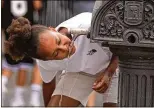  ?? AP 2023 ?? SPAIN: A girl drinks water from a fountain in Madrid. As in an oven, the longer heat lasts, the more something heats — people included.