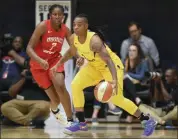  ?? NICK WASS - THE ASSOCIATED PRESS ?? FILE - In this Thursday, Aug. 23, 201 file photo, Los Angeles Sparks guard Riquna Williams, right, dribbles against Washington Mystics guard Ariel Atkins (7) in the first half of a single eliminatio­n WNBA playoff game in Washington.