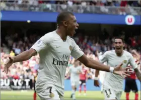  ?? THE ASSOCIATED PRESS ?? PSG’s Kylian Mbappe celebrates after scoring the second goal for his team during their League One soccer match between Guingamp and Paris Saint Germain at Roudourou stadium in Guingamp, western France, Saturday.