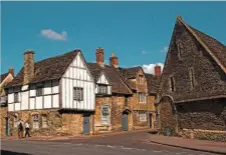  ??  ?? The Tithe Barn, on the right, a stone’s throw from the abbey, once used by the nuns of Lacock to store grain.