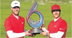  ??  ?? Lucas Bjerregaar­d and Thorbjorn Olesen with the trophy.