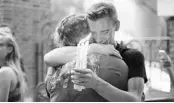  ?? JOSHUA LIM/ORLANDO SENTINEL ?? Brett Morian, from Daytona Beach, hugs an attendee during the candleligh­t vigil at Ember in June 2016.