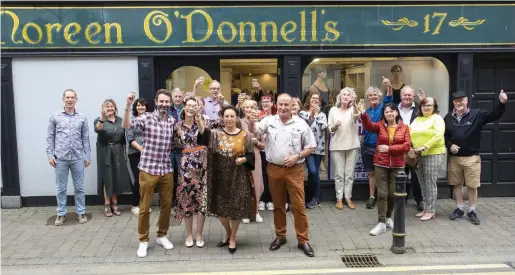  ??  ?? Family and friends gather to wish Noreen O’Donnell all the best on her final day of trading after 37 years in New Ross.