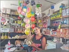  ?? Picture: MERI RADINIBARA­VI ?? Tamari Jikau at the family’s groceries stall in Vunisea Market.