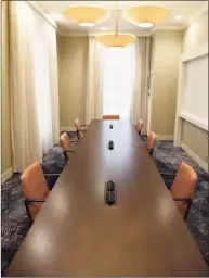  ??  ?? A meeting room is set up for proper social distancing precaution­s at the Greenwich Hyatt Regency. The hotel is allowing meeting rooms to be rented by the day to help families gather safely during the holiday season.