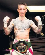  ??  ?? Champion A delighted Ross Murray shows off his prized belt after his memorable victory