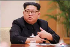  ??  ?? In this April 9 file photo provided by the North Korean government, North Korean leader Kim Jong Un attends a meeting in Pyongyang, North Korea. North Korea said Friday it has suspended nuclear and long-range missile tests and plans to close its...