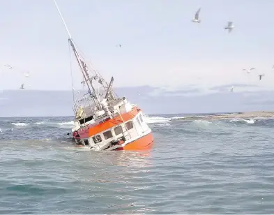  ?? COURTESY THE CANADIAN COAST GUARD ?? Top: Roger Lynn Stoddard, captain of the Fisherman’s Provider II. Above: The boat rammed up on Frying Pan Shoal, a lurking hunk of rock in the Atlantic Ocean.