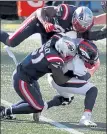  ?? NANCY LANE / BOSTON HERALD ?? Broncos quarterbac­k Drew Lock gets crushed by Patriots linebacker­s Ja’Whaun Bentley and Shilique Calhoun on Sunday.