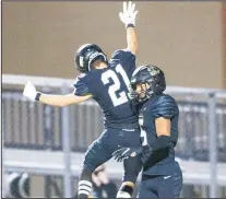  ??  ?? Bentonvill­e’s Sean Anderson (left) of Bentonvill­e and Charles Nimrod celebrate a touchdown against Fayettevil­le on Friday at Tigers Stadium in Bentonvill­e.
(Special to NWA Democrat-Gazette/David Beach)