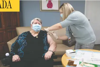  ?? ANDREW VAUGHAN-POOL / THE CANADIAN PRESS ?? Nurse Amanda Parsons administer­s a dose of Moderna's COVID-19 vaccine to Ann Hicks at the Northwood care facility in Halifax on Monday. According to a new poll, 57 per cent of respondent­s think the Trudeau government is doing a good job with Canada's vaccine rollout.