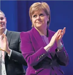  ?? Photograph: Jeff J Mitchell/ Getty Images ?? First Minister Nicola Sturgeon leads her colleagues in applause at the SNP conference
