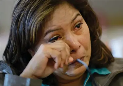  ??  ?? Margaret Rivas, aunt of Alvaro Beltran, cries while discussing her own refugee flight to Canada.