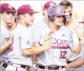  ?? ?? Texas A&M’S Troy Claunch (12) celebrates with teammates after scoring against Louisiana on Saturday night. (Photo by Michael Miller, College Station Eagle, AP)