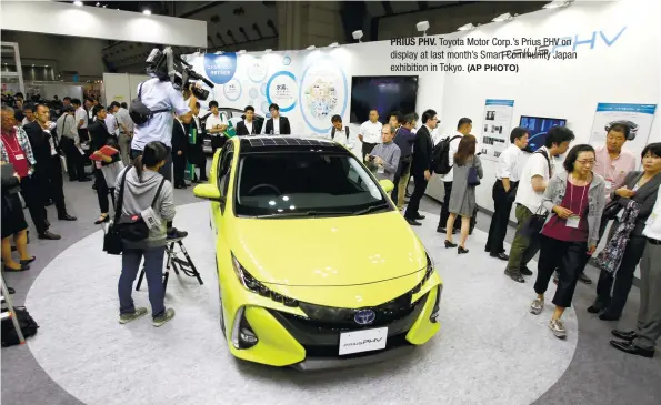  ?? (AP PHOTO) ?? PRIUS PHV. Toyota Motor Corp.’s Prius PHV on display at last month’s Smart Community Japan exhibition in Tokyo.