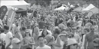  ?? The Daily Courier ?? Hundreds walk along Bernard Avenue during the 27th annual Block Party in 2016. The City of Kelowna will shut down Bernard for the entire summer this year in an attempt to spur on the economy.