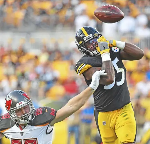  ?? Peter Diana/ Post- Gazette ?? Steelers linebacker Devin Bush breaks up a pass intended for Tampa Bay Buccaneers tight end Tanner Hudson.