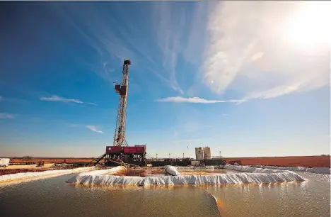  ?? JAMES DURBIN/REPORTER-TELEGRAM VIA AP FILES ?? A water pool is attached to Robinson Drilling rig No. 4 in Midland County, Texas. Our only customer, the U.S., has become the disrupter with its shale revolution taking off and it may be altogether too late to do anything about it, writes Martin...