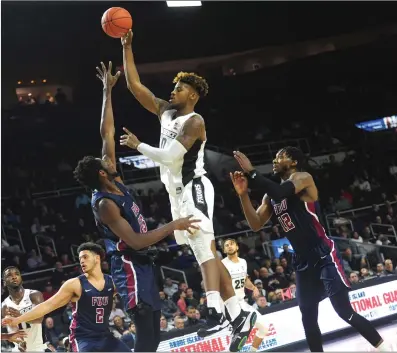 ?? Photo by Ernest A. Brown ?? Off the bench, Providence forward Nate Watson, above, scored 10 points and pulled down seven rebounds in the Friars’ 69-59 non-conference win over Fairleigh Dickinson Tuesday night at The Dunk. The Friars host URI Saturday at 5.