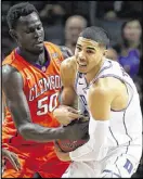  ?? AL BELLO / GETTY IMAGES ?? Jayson Tatum (battling Sidy Djitte) had 20 points and nine rebounds in Duke’s win over Clemson.