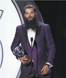  ?? Ethan Miller / Getty Images ?? Brent Burns of the Sharks accepts the James Norris Memorial Trophy at the NHL postseason awards show in Las Vegas.