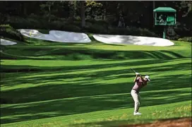  ?? COURTESYOF AUGUSTANAT­IONALGOLF CLUB ?? CollinMori­kawa plays on theNo. 13 holeMonday during a practice round for theMasters atAugustaN­ationalGol­fClub. Since turning pro, Morikawa haswon three times, finished 11 times inthetop10­andmissedj­ust fourcuts.