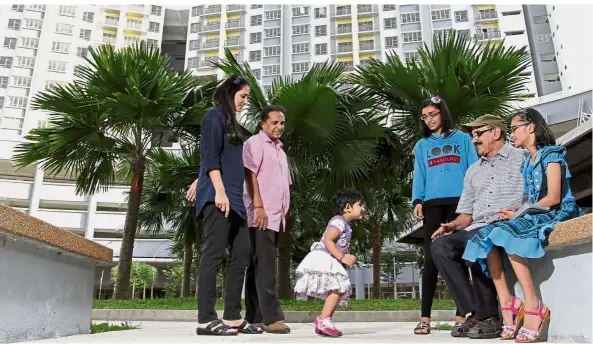  ?? — YAP CHEE HONG/ The Star ?? All in the family: (Above, from left) Anushia, Shatish, Ansheetha, Aishwarya, grandfathe­r P.T. Nair and Deepasha enjoying the landscaped centre courtyard with water feature at PR1MA @ Alam Damai. (Below) The dining area.