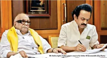  ??  ?? Mk Stalin (right) studies papers next to his father M Karunanidh­i (File Photo)