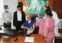  ?? ?? LEADING BY EXAMPLE Dr Devi Shetty takes a Covid vaccine shot in Bengaluru