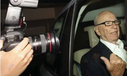  ?? ?? Rupert Murdoch leaving his London flat at the height of the phone-hacking scandal in 2011. Photograph: Oli Scarff/Getty Images