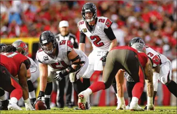  ?? MICHAEL REAVES / GETTY IMAGES ?? The Falcons’ offensive line struggled with the Bucs’ stout defensive front as quarterbac­k Matt Ryan was sacked six times and hit 14 more times Sunday. Ryan was sacked a career-high 48 times this season.