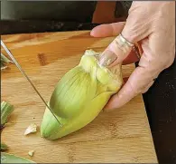  ??  ?? You get to the artichoke heart by peeling off all of the outer leaves until you get to light yellow.