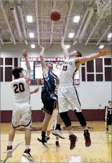  ?? Bud Sullins/Special to Siloam Sunday ?? Siloam Springs sophomore Murphy Perkins, left, and senior Harrison Kretzer, right, defend against Greenwood’s Jordan Sheppard in the seventh-place game of the Siloam Springs Holiday Classic on Friday at the Panther Activity Center. The Panthers defeated the Bulldogs 61-47.