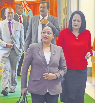  ?? Picture: JONA KONATACI ?? Minister for Industry, Trade and Local Government Premila Kumar (middle) and Education Minister Rosy Akbar (right) leave Parliament during a break in sitting for the COVID-19 Response Budget yesterday.