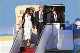  ?? BRUCE R. BENNETT / THE PALM BEACH POST ?? President Donald Trump and first lady Melania Trump arrive Friday at Palm Beach Internatio­nal Airport for a weekend visit.