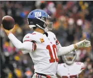  ?? Mark Tenally / Associated Press ?? New York Giants quarterbac­k Eli Manning throws the ball against the Washington Redskins on Sunday in Landover, Md.