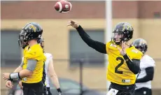  ?? PETER POWER/THE CANADIAN PRESS ?? U.S. reporters are headed to Hamilton to see how new Tiger-Cats quarterbac­k Johnny Manziel fares.