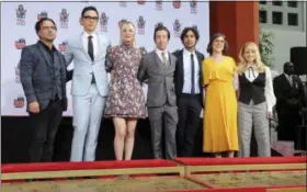  ?? WILLY SANJUAN — THE ASSOCIATED PRESS ?? From left, “The Big Bang Theory” cast members Johnny Galecki, Jim Parsons, Kaley Cuoco, Simon Helberg, Kunal Nayyar, Mayim Bialik and Melissa Rauch are photograph­ed at a hand and footprint ceremony at the TCL Chinese Theatre in Los Angeles earlier this month.