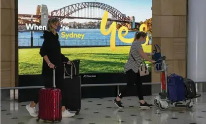  ?? ?? Passengers arrive at Sydney airport on Monday. Australia’s national cabinet will meet soon to discuss potential new border restrictio­ns over the Omicron variant of Covid-19. Photograph: Mark Baker/AP