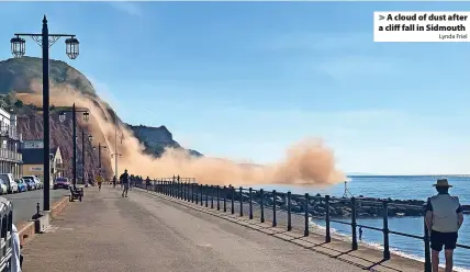  ?? Lynda Friel ?? > A cloud of dust after a cliff fall in Sidmouth