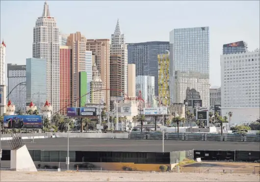  ?? K.M. Cannon Las Vegas Review-Journal @KMCannonPh­oto ?? Projects planned for the south end of the Strip have fallen behind schedule during the coronaviru­s pandemic.