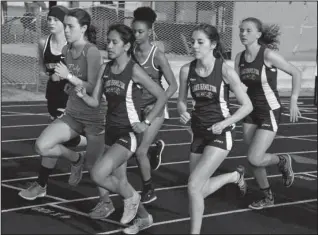  ?? Submitted photo ?? LEADING THE PACK: Lake Hamilton showed a strong presence in the 1600-meter run with, from left, Anacaron Ramos, Morgan Pruitt and Anna Cole taking the top three places. Pruitt won the event with Ramos and Cole taking second and third, respective­ly....