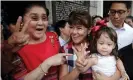  ??  ?? Imee Marcos (centre in checked shirt) in Manila last year with her mother, the former first lady Imelda Marcos. Photograph: Francis R Malasig/EPA