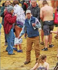  ?? CHRIS BARBER — DIGITAL FIRST MEDIA ?? Brandywine Red Clay Alliance Executive Director Jim Jordan greets the swimmers as they return.