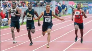  ?? MICHAEL REEVES — DIGITAL FIRST MEDIA FILE ?? Coatesvill­e’s Terrance Laird (third from left) crosses the finish line first to win gold for his team in the Class 3A 4x100 relay at the PIAA Championsh­ips.