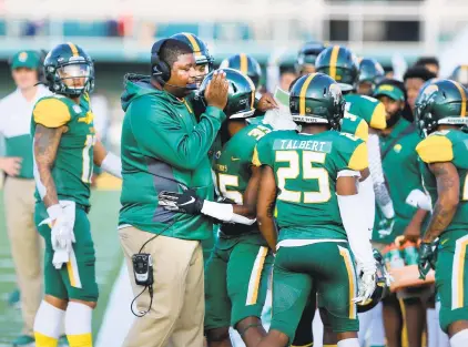  ?? JASON HIRSCHFELD/FREELANCE FILE ?? Norfolk State head coach Latrell Scott, pictured celebratin­g with Kevin Johnson during a 2019 game, resigned Wednesday and will reportedly become an assistant coach at East Carolina.