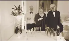  ?? 25_c07ensembl­e16 ?? Archie MacBrayne, Rolline McKerral and Phil Connor served Prosecco to all guests on arrival.